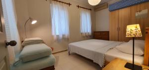Postel nebo postele na pokoji v ubytování A&B Home Hotel