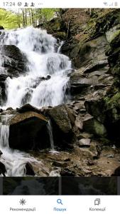 a picture of a waterfall on the side of a river at Радуга in Podobovets