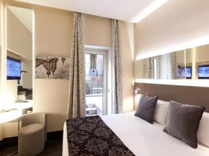 Posteľ alebo postele v izbe v ubytovaní Quirinale Luxury Rooms