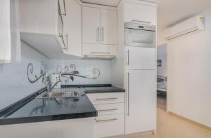 Kuchyň nebo kuchyňský kout v ubytování Apartment Tulipan