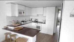 Virtuvė arba virtuvėlė apgyvendinimo įstaigoje Île de Ré - T3 avec sublime vue mer - 80m2 - 4 à 6 pers