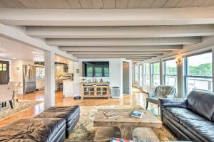 a living room with a couch and a table at Stunning Enfield Home with Deck and Boat Dock! in Enfield