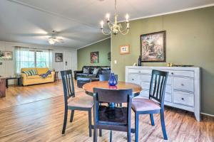 a dining room and living room with a table and chairs at Cheery St Augustine Retreat - 5 Mi to Dtwn! in St. Augustine