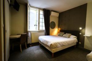 Postel nebo postele na pokoji v ubytování Hostellerie Bellevue