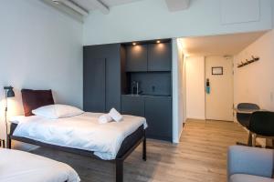 En eller flere senge i et værelse på CPH Studio Hotel