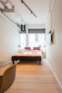 Postel nebo postele na pokoji v ubytování CPH Studio Hotel