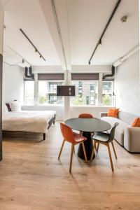 En eller flere senge i et værelse på CPH Studio Hotel