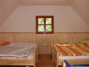 Postel nebo postele na pokoji v ubytování Chaty u rybníka Brodský