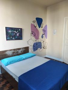 Cama ou camas em um quarto em Lumiar Hostel