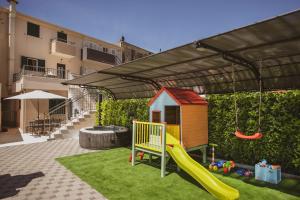 a play area with a slide and a playground at Luxury house Lucija in Dugi Rat