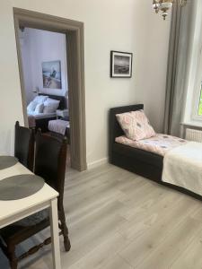 Postel nebo postele na pokoji v ubytování Apartamenty u Ewy - EUROS