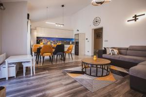a living room with a couch and a table at Luxury house Lucija in Dugi Rat
