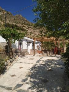 a house with a pavilion in front of it at Loma Negra in Dúrcal