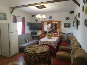 a living room with a couch and a table at Loma Negra in Dúrcal