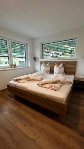 Ένα ή περισσότερα κρεβάτια σε δωμάτιο στο Alpenresidenz M Vermietungs KG