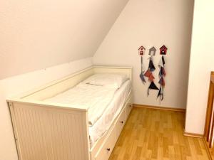 Postel nebo postele na pokoji v ubytování Ferienwohnung 6 im Böhler Haubarg