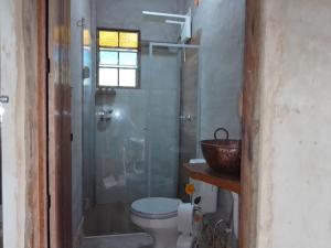 Ванная комната в Chalé Caiçara