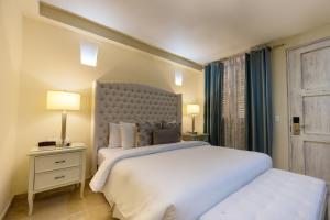 Postel nebo postele na pokoji v ubytování Hotel Casa Canabal by Faranda Boutique