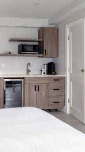 a kitchen with a sink and a counter top at Falmouth Tides in Falmouth