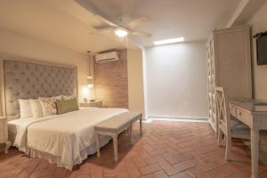 Postel nebo postele na pokoji v ubytování Hotel Casa Canabal by Faranda Boutique