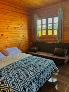 Ένα ή περισσότερα κρεβάτια σε δωμάτιο στο Refúgio 370