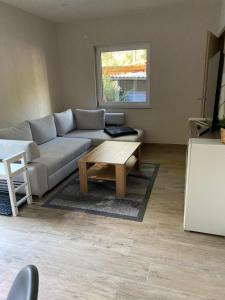 a living room with a couch and a coffee table at Ferienhaus Pepe in Graal-Müritz