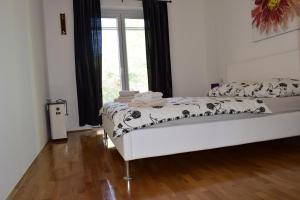 Posteľ alebo postele v izbe v ubytovaní Apartments Sunshine & Smile