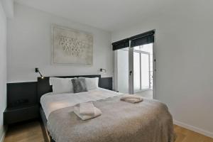 Giường trong phòng chung tại Top location! Unique luxurious 2-bedroom apartment in Knokke - 't Zoute
