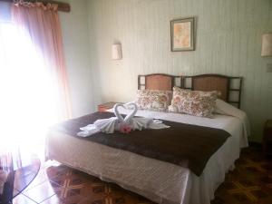 Postel nebo postele na pokoji v ubytování Tupa Hotel