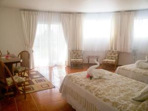 Postel nebo postele na pokoji v ubytování Tupa Hotel