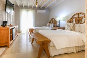 Postel nebo postele na pokoji v ubytování Hotel Casa Canabal by Faranda Boutique