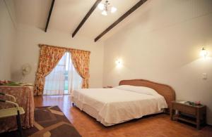 Postel nebo postele na pokoji v ubytování Tupa Hotel