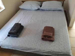 Posteľ alebo postele v izbe v ubytovaní Apartmani ZP44