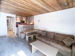 a living room with a couch and a table at Studio Tignes, 2 pièces, 4 personnes - FR-1-502-156 in Tignes