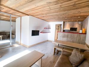 a living room with a couch and a table at Studio Tignes, 2 pièces, 4 personnes - FR-1-502-156 in Tignes