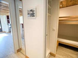 a walk in closet in a room with shelves at Studio Tignes, 2 pièces, 4 personnes - FR-1-502-156 in Tignes