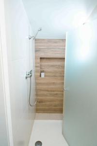 a bathroom with a shower with a glass door at Cascais Bay Hostel in Cascais +52 photos