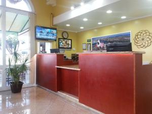 a lobby of a hospital with a reception counter at Vagabond Inn San Pedro in San Pedro