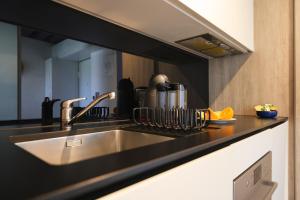 Kuchyň nebo kuchyňský kout v ubytování Apartment F