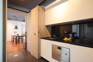 Kuchyň nebo kuchyňský kout v ubytování Apartment F