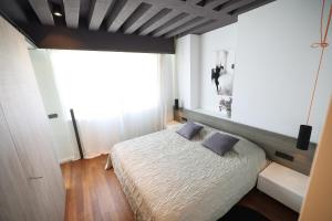 Posteľ alebo postele v izbe v ubytovaní Apartment F