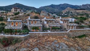 an aerial view of a house on a hill at Lithos Villas in Karistos