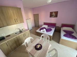 Postel nebo postele na pokoji v ubytování Hotel Vila Ali