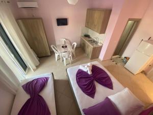 Postel nebo postele na pokoji v ubytování Hotel Vila Ali