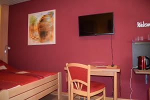 TV a/nebo společenská místnost v ubytování Gästezimmer Leonore