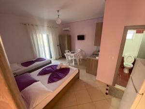Postel nebo postele na pokoji v ubytování Hotel Vila Ali
