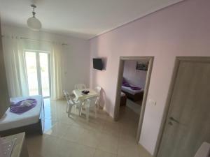Postel nebo postele na pokoji v ubytování Hotel Vila Ali