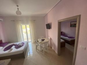 Postel nebo postele na pokoji v ubytování Hotel Vila Ali