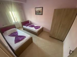 Postel nebo postele na pokoji v ubytování Hotel Vila Ali