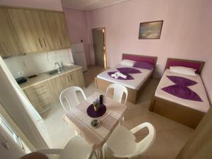 Postel nebo postele na pokoji v ubytování Hotel Vila Ali